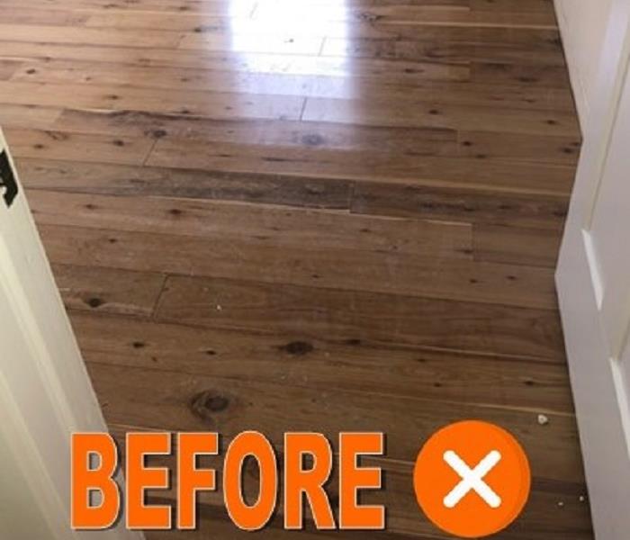 Wood flooring which has been affected by water is cupping.