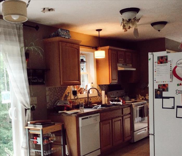 A kitchen with water damage before it was worked on