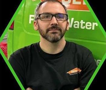 Male SERVPRO employee in black shirt.