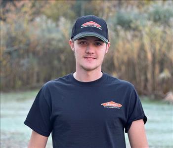 Male SERVPRO employee with black shirt.