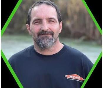 Male SERVPRO employee with black shirt.